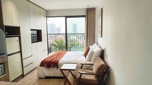Deluxe Studio, Balcony, City View | Minibar, desk, laptop workspace, blackout drapes - Hanoi Aurelia Stay (Tay Ho)