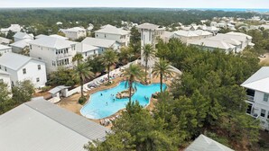 A residential area with houses, a swimming pool, and a view of the ocean. - Community Pool and Hot Tub Access | LSV (Santa Rosa Beach)