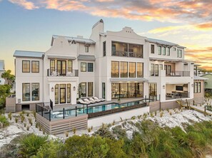 A multi-story house with a pool, balconies, and a beach view. - Newly Built | Pool | LSV | YOLO Boards (Santa Rosa Beach)