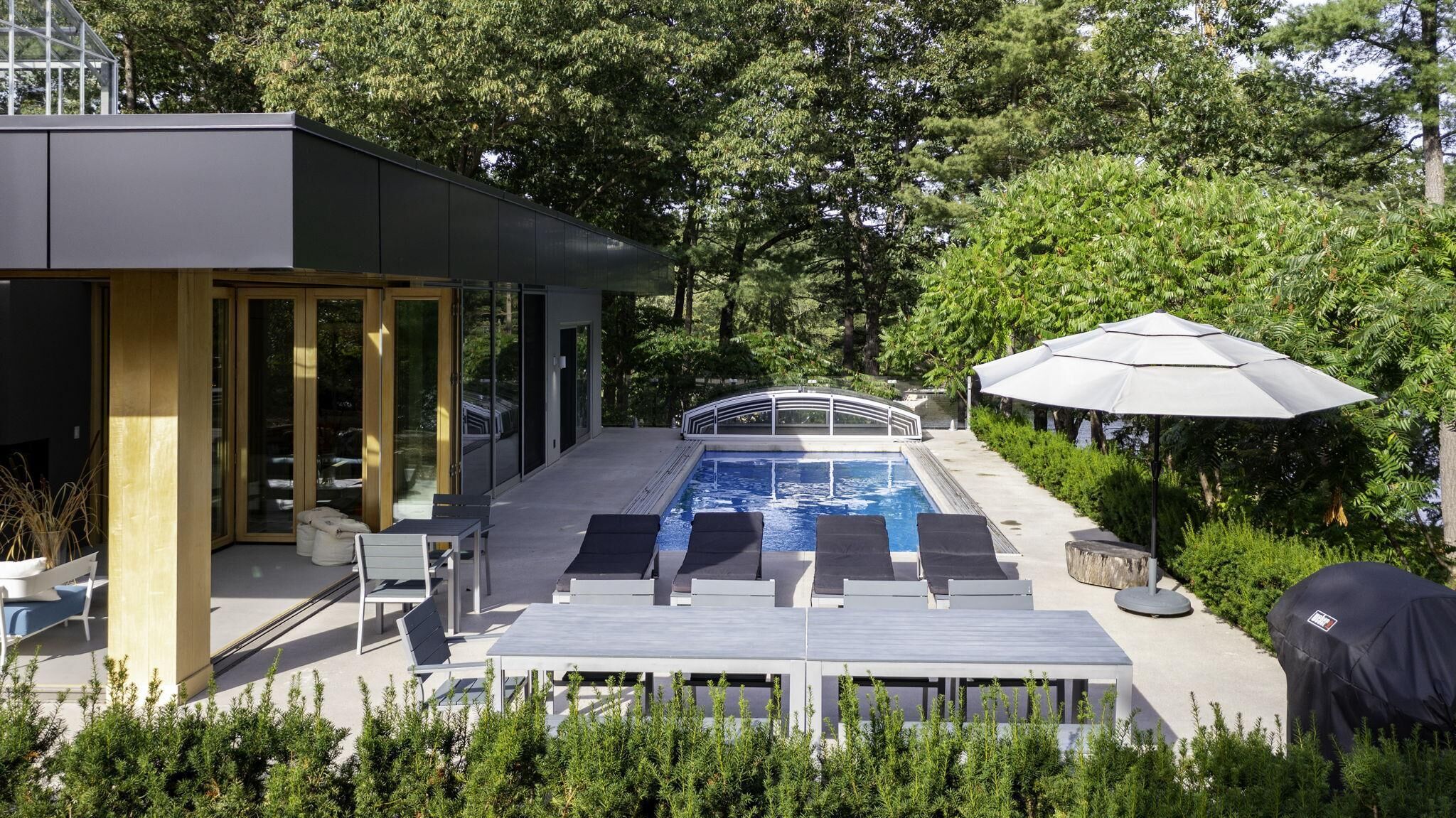 Poolside patio with chaise lounges for sun soaked relaxation