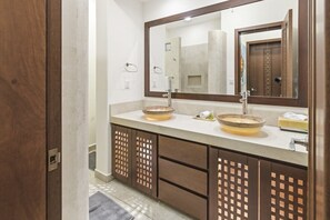 A bathroom with two sinks, a large mirror, and wooden cabinets. - One Bedroom Oceanfront - Puerto Escondido 1352 (Bajos de Chila)