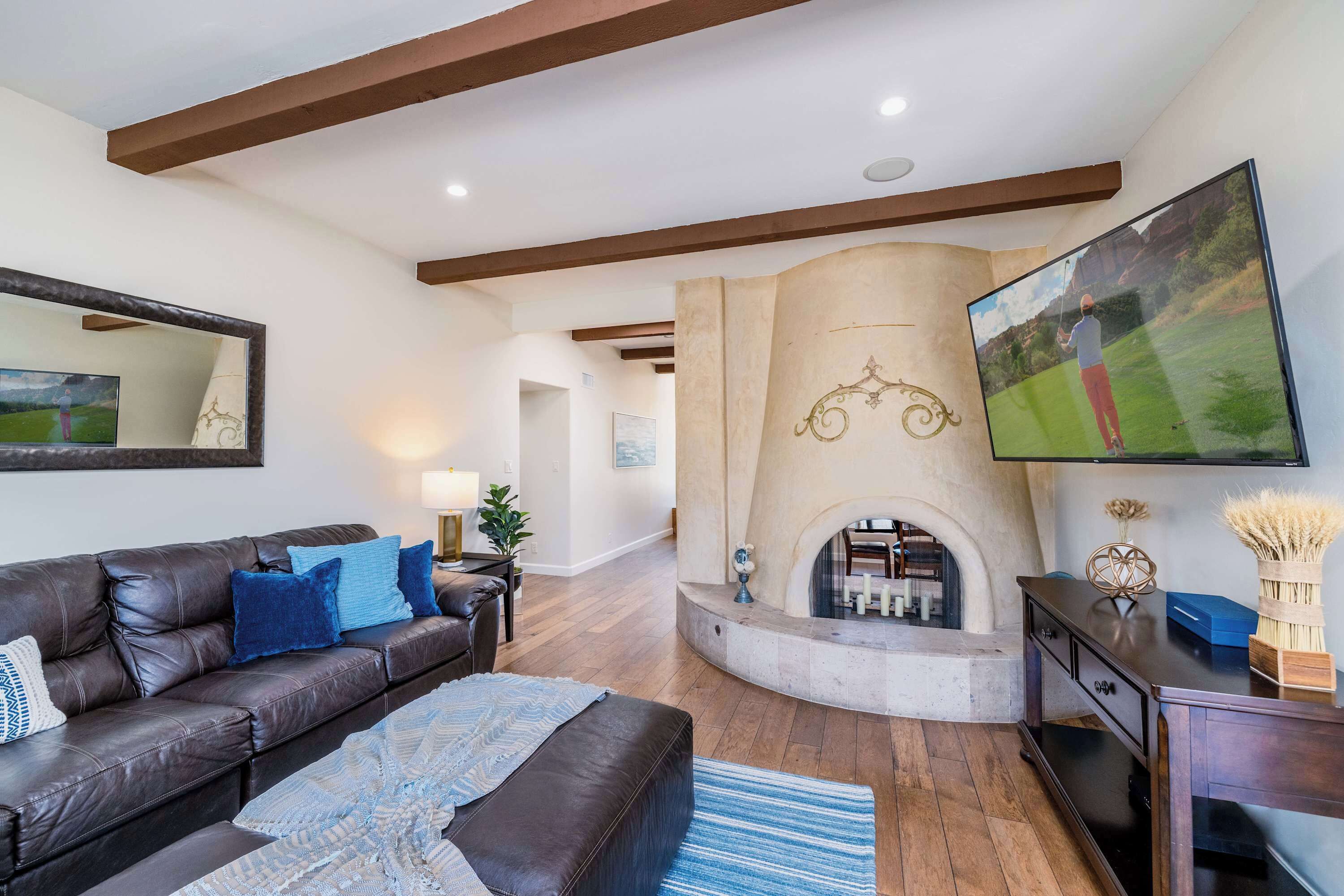 Comfortable living room with a fireplace and large Smart TV.