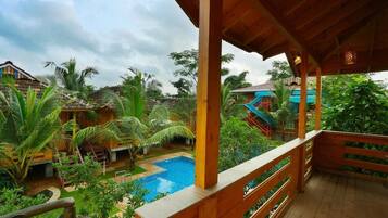 Deluxe Double Room, Balcony, Pool View | Property grounds