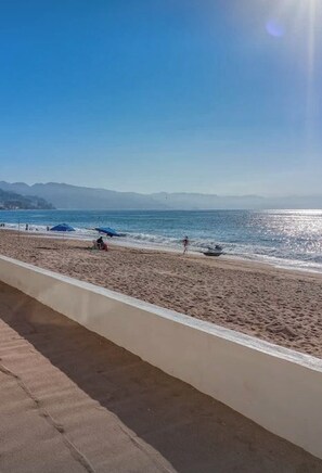 On the beach, sun-loungers, beach towels - Luxury new oceanside condo  prime sun,nightlife & relaxation all in one place! (Puerto Vallarta)