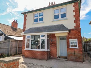 A two-story house with a bay window, a front door, and a number '54' on the door. - 54 George Street (Mablethorpe)
