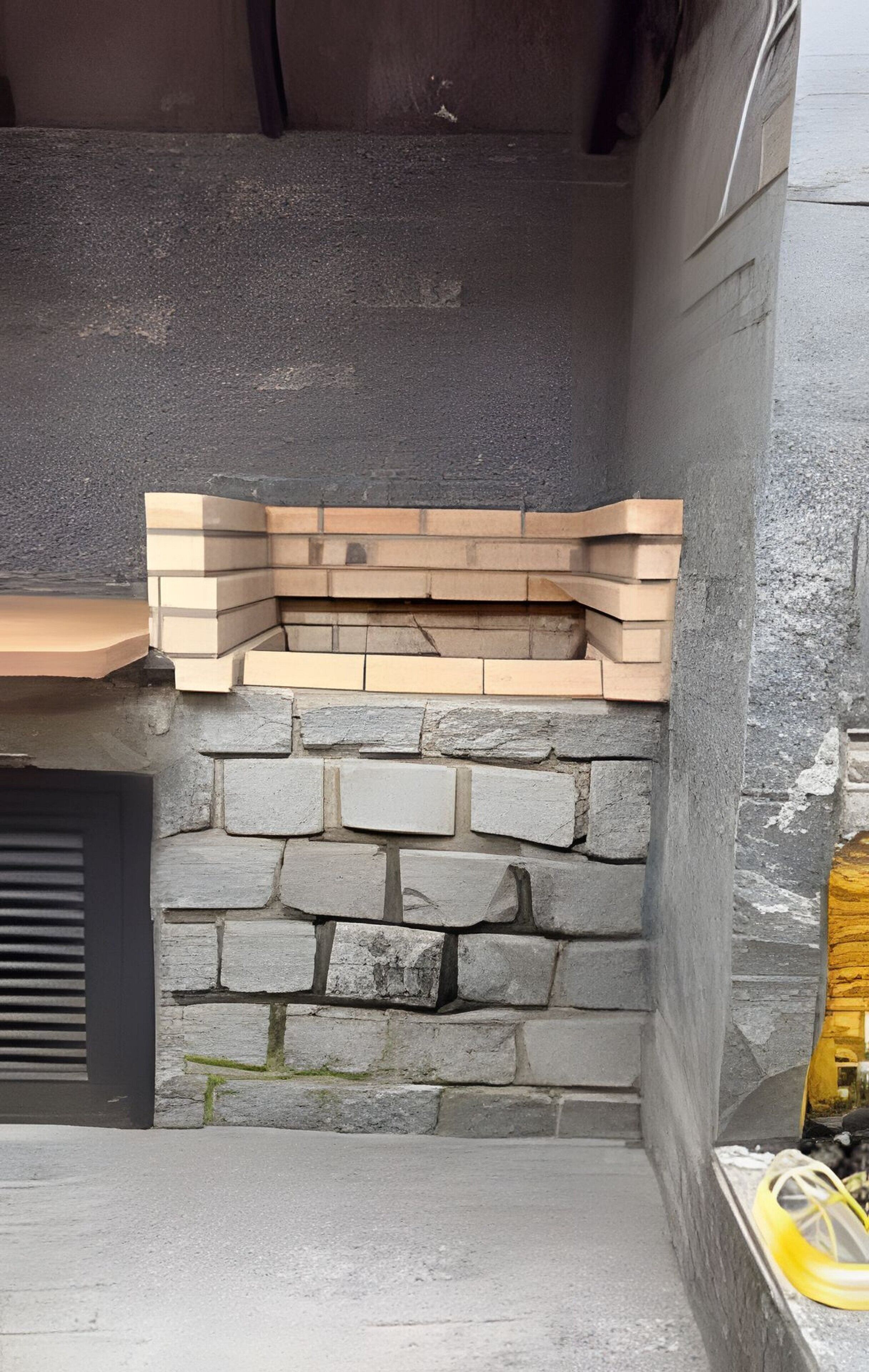 A stone wall with a built-in bench.