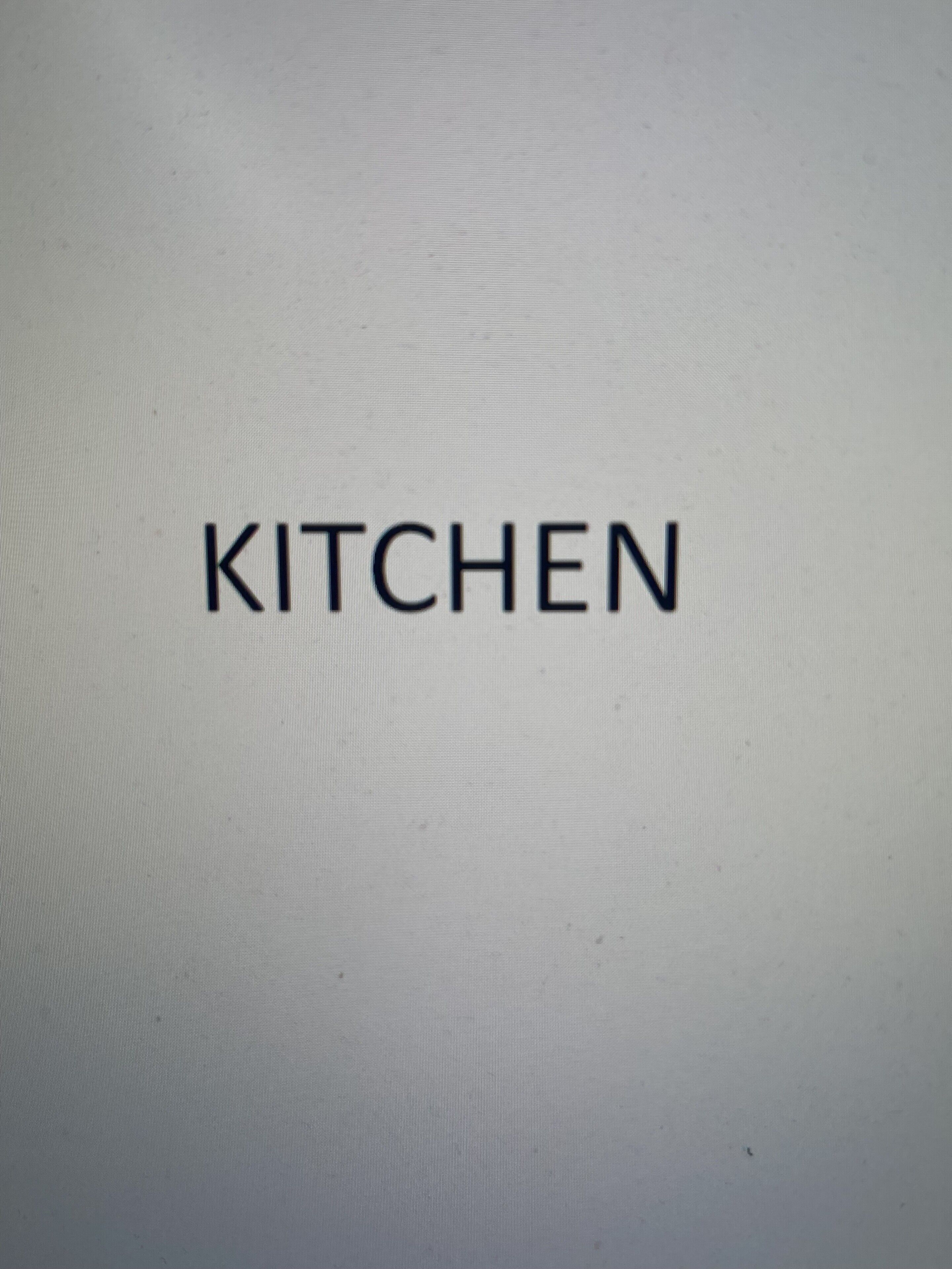 A plain background with the word 'KITCHEN' in the center.
