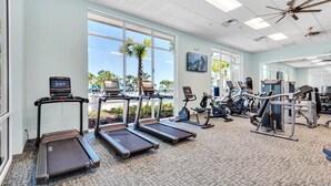 A gym with treadmills, exercise bikes, and weight machines. - Upstay Disney Family Adventure with Pool & Hot Tub (Davenport)