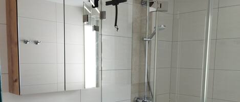 Shower, hair dryer, towels, soap