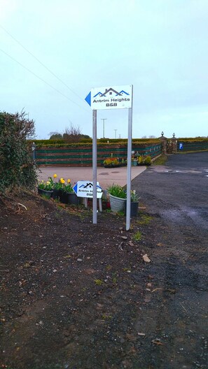 A sign for Antrim Heights B&B with a directional arrow.