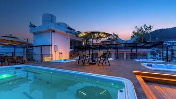 Outdoor pool, open 8:00 PM to midnight, pool umbrellas