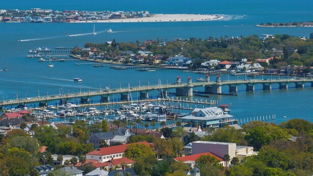 A coastal marina with boats, a bridge, and buildings. - Bright Beach Condo, Pool, Spa, Comfy Beds, Patio (St. Augustine)