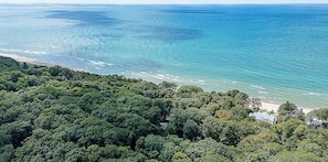 A coastal landscape with dense greenery and a beach. - Family Luxury Lake Michigan Cottage w/ Hot Tub (West Olive)
