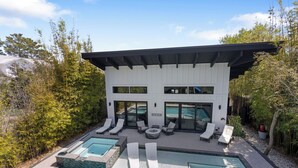 A modern house with a pool, lounge chairs, and a patio area. - Poole Party! Incredible Pool, Beachside of 30A (Seagrove Beach)