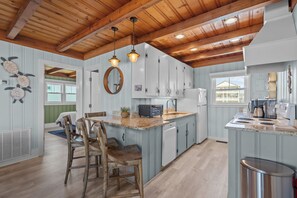 Fridge, microwave, oven, stovetop - Hasslin Hound: 4-bedroom Oceanview, Pet Friendly, steps from East Beach, Oak Island, NC. (Oak Island)