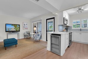 TV - Coquina Club 105 I Sunny Coastal Escape | Steps to the Beach, Stroll to Dining & Shops (Naples)