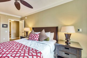 A hotel room with a bed, two bedside tables, a ceiling fan, and a thermostat. - 2 Honua Kai Villas | Ocean Front | Sleeps 12 | Free Car w/ 6+ Nights | ML-2780 (Lahaina)