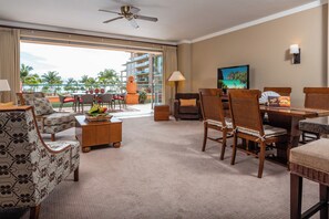 A hotel room with a balcony, a dining area, and a television. - 2 Honua Kai Villas | Ocean Front | Sleeps 12 | Free Car w/ 6+ Nights | ML-3158 (Lahaina)