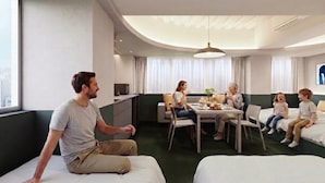 A modern hotel room with a dining area, a sofa, and a bed. - HUBEX AKIHABARA (Tokyo)