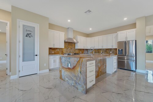 Spacious 5-bedroom villa in half acre lot in Las Vegas with RV Garage