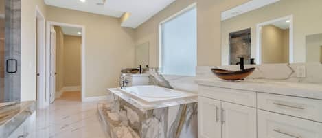 Jetted tub, hair dryer, towels, soap