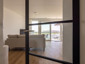 Living area - Stylish harbour apartment with balcony & view (Kortgene)