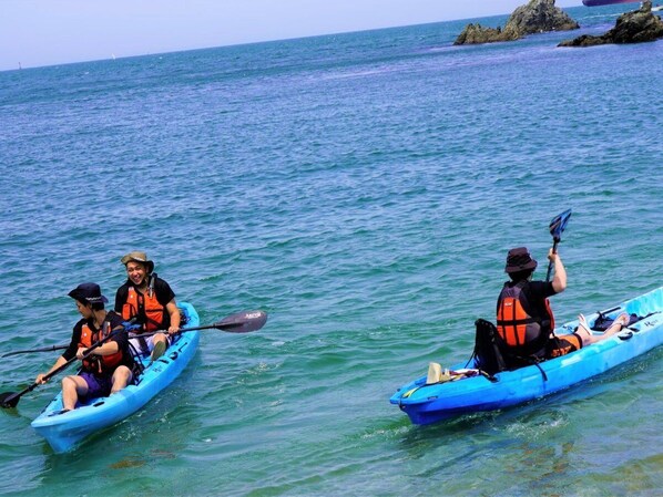 Two kayaks on calm water, each with a person wearing a life jacket. - Komatsushima Resort (Tokushima)