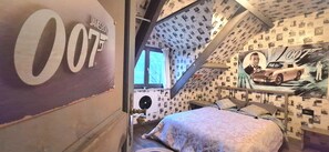 A bedroom with a bed, a poster of a car, and a wall with a large number '007'. - House Ardennes Blue in Theux Near Spa (Theux)
