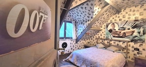 A bedroom with a bed, a poster of a car, and a wall with a large number '007'. - House Ardennes Blue in Theux Near Spa (Theux)