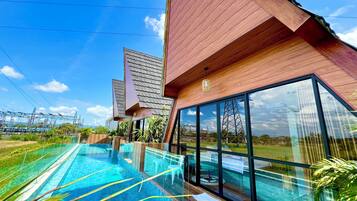 Deluxe Room, Patio, Pool View | Terrace/patio