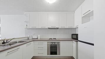 Fridge, microwave, stovetop, coffee/tea maker