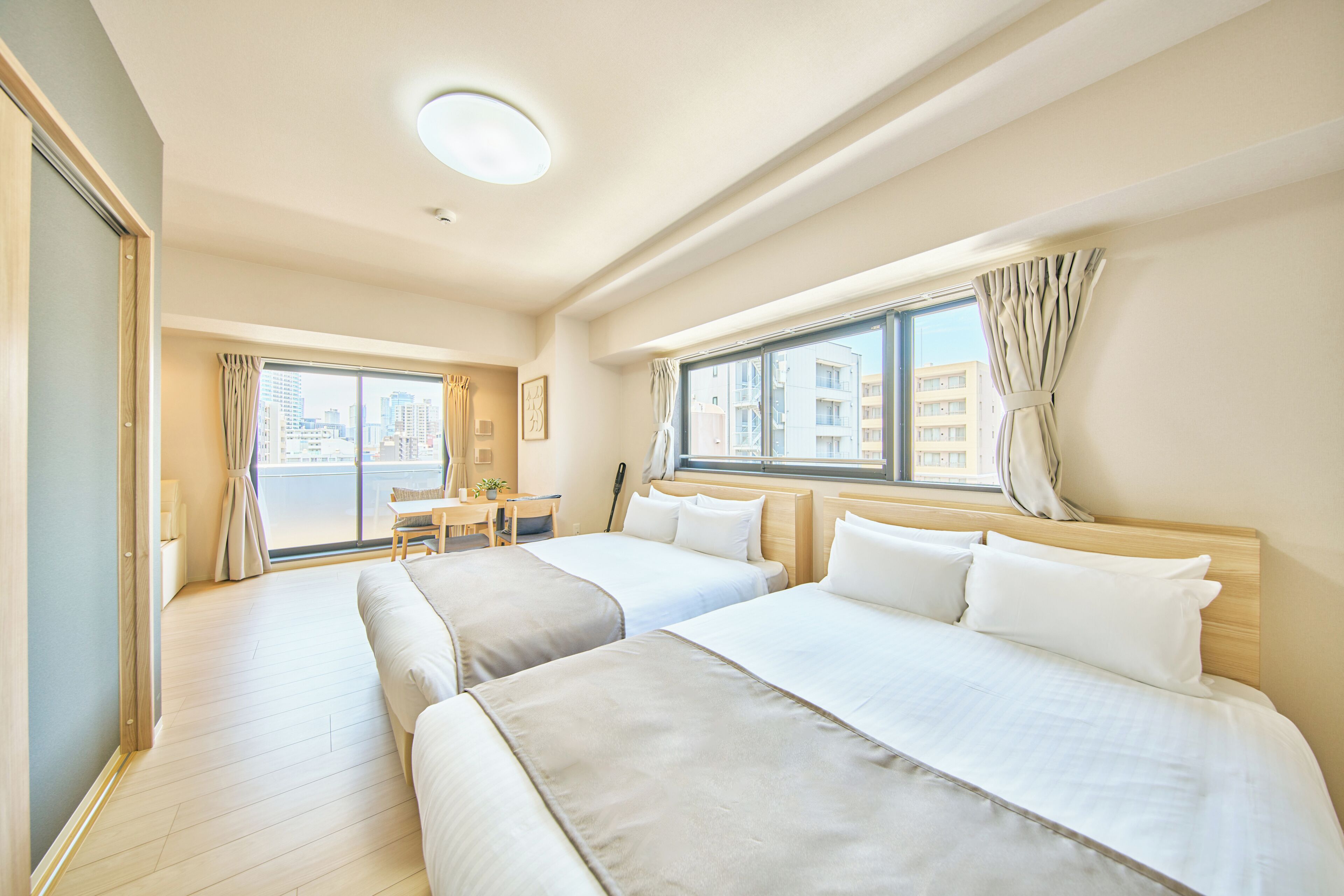 Family Apartment, Lanai, City View | Blackout curtains, iron/ironing board (on request), free WiFi