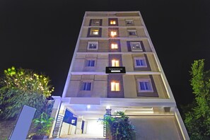 A multi-story hotel with a sign indicating 'Company Services.'