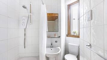 Shower, hair dryer, towels, shampoo