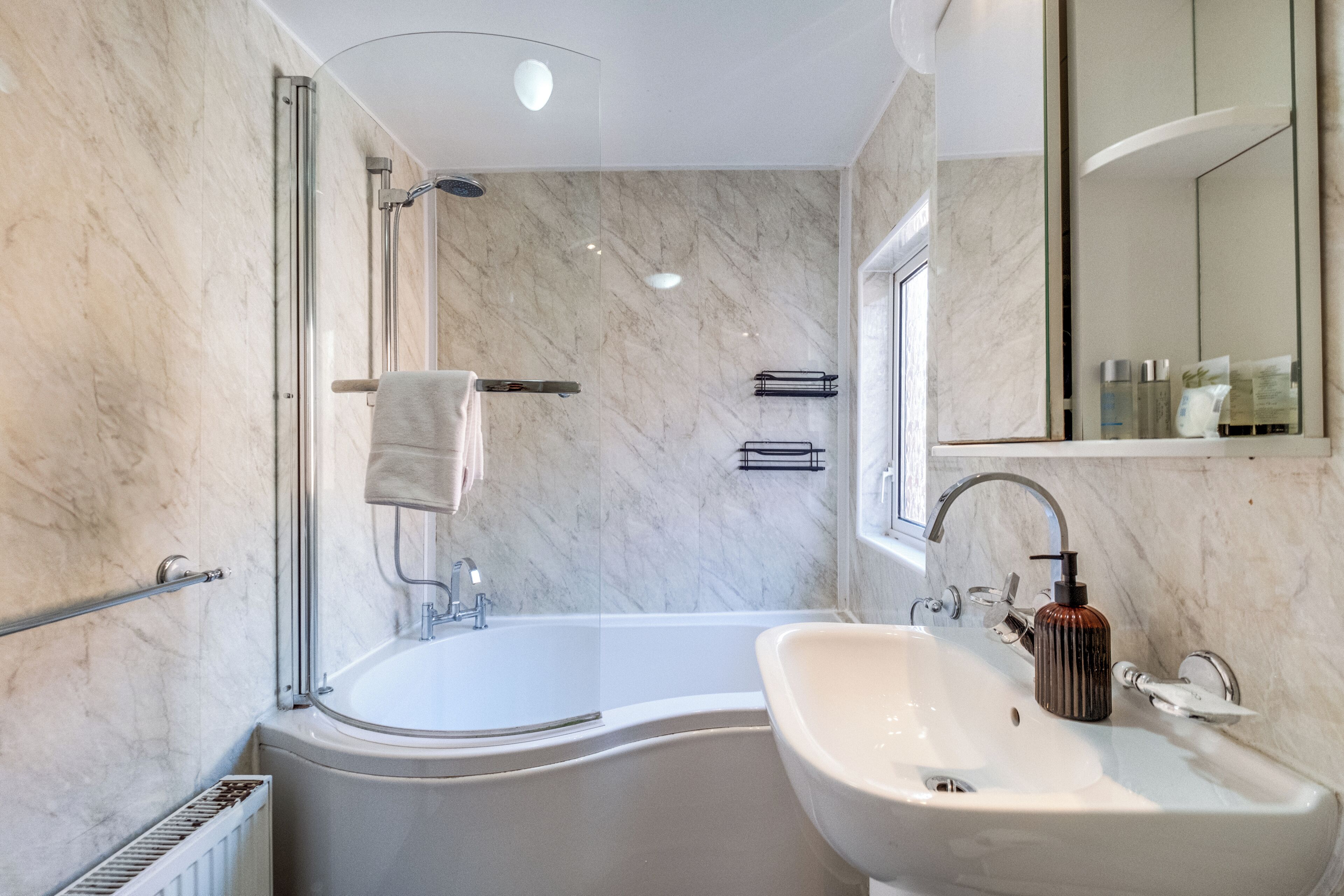 Shower, hair dryer, towels, soap