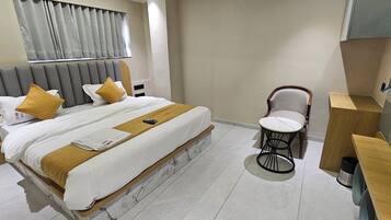 Deluxe Double Room, City View | In-room safe, desk, laptop workspace, iron/ironing board