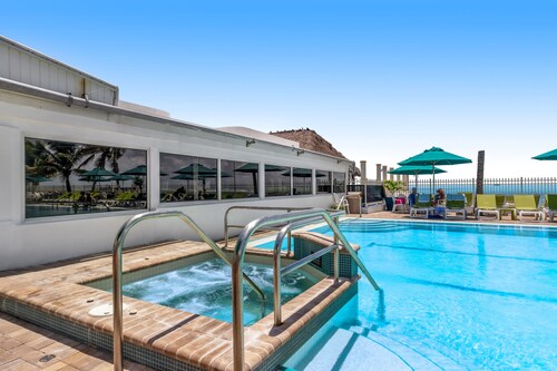 Canal-front home with Cabana Club access, water view, & private W/D