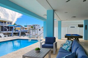 A heated pool - Sprawling waterfront home with pool, outdoor kitchen, game table, grill, & W/D (Key Largo)