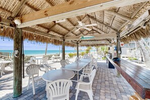 Outdoor dining - Historically located condo w/ocean views, pool, loft, AC & guest boat access (Layton)