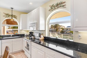 Fridge, microwave, oven, stovetop - Breezy waterfront home with pool, 35-foot dock & cabana club access (Key Colony Beach)