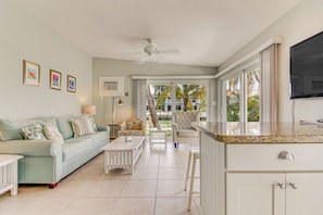 TV, books - Waterfront home with 24-foot dock, shared pool, & beach access (Key Colony Beach)