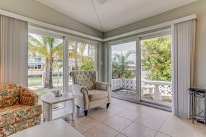TV, books - Waterfront home with 24-foot dock, shared pool, & beach access (Key Colony Beach)