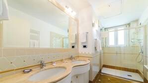 A bathroom with two sinks, a large mirror, a shower, and a toilet. - AMALFI GALLERY (Amalfi)