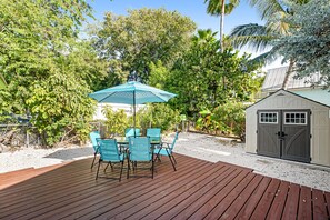 Outdoor dining - Bright Keys Cottage with Enclosed Yard, Deck, Porch, Partial, AC, & WiFi (Key West)