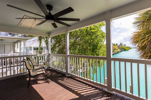 Waterfront, dog-friendly home with beautiful canal view & 2 shaded porches