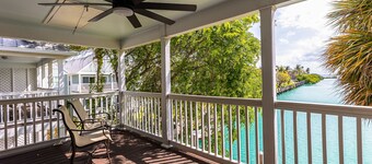 Waterfront, dog-friendly home with beautiful canal view & 2 shaded porches
