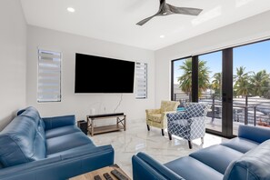 Smart TV - Modern canal-front home with a rooftop deck, open-concept interior, AC, & W/D (Marathon)