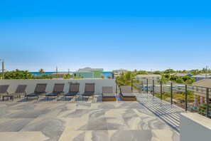 Terrace/patio - Modern canal-front home with a rooftop deck, open-concept interior, AC, & W/D (Marathon)