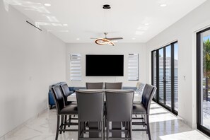 Dining - Modern canal-front home with a rooftop deck, open-concept interior, AC, & W/D (Marathon)
