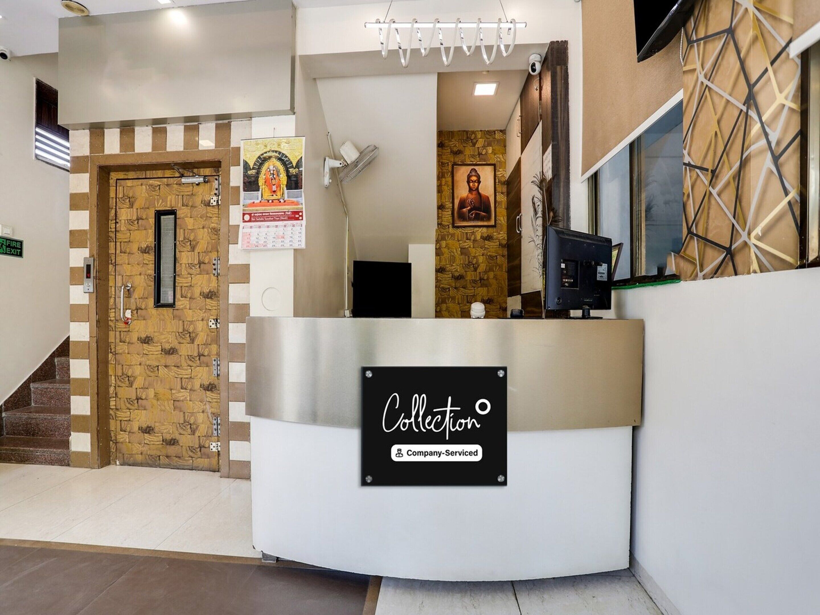 A reception desk with a sign reading 'Collection Company-Serviced.'